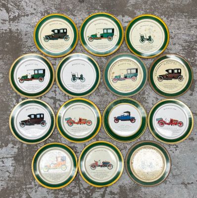 several plates with different types of cars on them sitting on a table