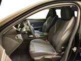 the interior of a car with the door open and the driver ' s seat up
