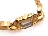 yellow gold plated bracelet with a square stone in the center