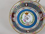a cup and saucer sitting on a table