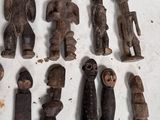 a lot of wooden figurines that are on a table