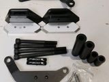 an image of a close up of a pair of black and white parts on a table