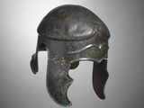 a bronze helmet on a gray background