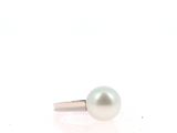 an image of a white pearl ring on a white surface