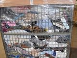 a cart with many items in it in a warehouse