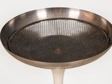 a large metal pan with a metal strainer on it