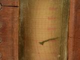 a small wooden box with a clock inside of it