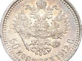 a close up of a coin with a crown on top of it