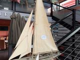 a model of a sailboat on display in a museum