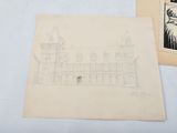 a drawing of a castle on a table next to a drawing of a castle