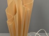 a lamp that is sitting on a table next to some wires