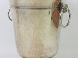 silver plated ice bucket with two handles and a metal ring handle