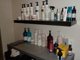 many different types of hair products on a shelf