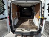 a white van that is parked in a lot with its door open