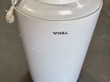 an image of a white ice cream maker in a warehouse