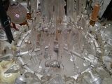 a glass chandelier that has a lot of glass on it