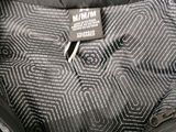 an image of a close up of a backpack with a tag on it
