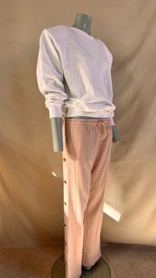 an image of a mannequin wearing a white shirt and pink pants