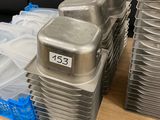 many pans of food sitting on a tray on a table