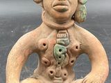 an image of a statue of a man with a hat on his head