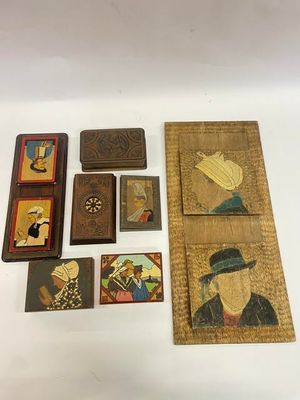 several pieces of art are displayed on a white surface