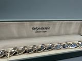 a silver bracelet with a chain that has been set in a box