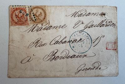 une vieille carte postale sur laquelle figure l'image d'une horloge