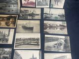 a lot of old photos on display on the table