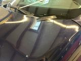 a close up of a car ' s hood with a sticker on it