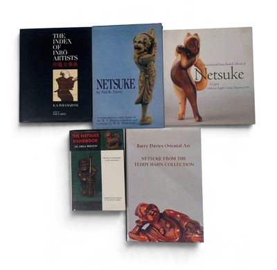 three books on a white surface with a white background