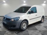 the white van is parked on a checkered floor in a room