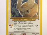 pokemon card with a picture of a yellow helmet on top of it