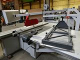 a machine that is cutting a piece of metal