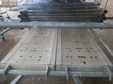 a pile of metal pipes sitting on top of a table