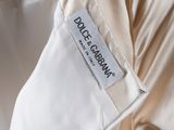 a close up of a white shirt with a label on it