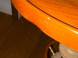 a teddy bear that is sitting on a wooden table