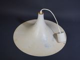 a white lamp that is sitting on a table