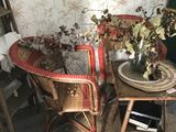 a table and chairs in a room with a rug on the floor