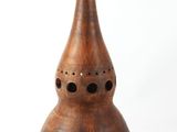 a wooden lamp that is sitting on a table