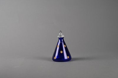 an image of a blue glass candle holder on a grey background