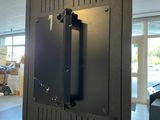 a picture of a black metal door in a building