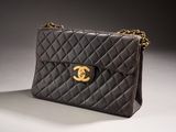 a black chanel bag with gold hardware