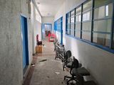 a long hallway with a bunch of chairs in it