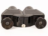 a pair of binoculars sitting on top of each other