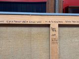 a picture of a wooden frame with writing on it