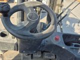 a close up of the steering of a forklift