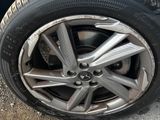 the tire of a car with a flat tire on the ground