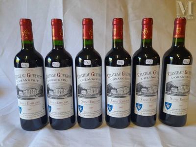 six bottles of red wine are lined up on a table