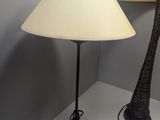 a lamp that is sitting on a table next to a lamp