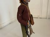 figurine of a man with a gun and a dog